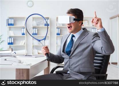 Businessman playing virtual reality tennis in office with VR goggle. Businessman playing virtual reality tennis in office with VR gog