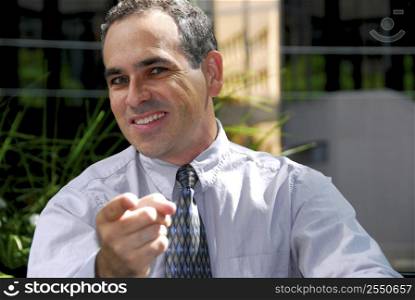 Businessman pointing a finger