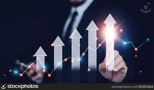 Businessman pointing arrow graph corporate future growth plan, Business development to success and growing growth concept,  finance and banking, marketing, strategy and planning to corporate.