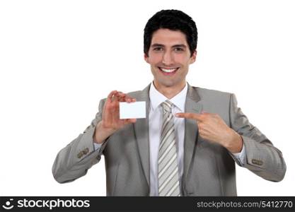 Businessman pointing at card