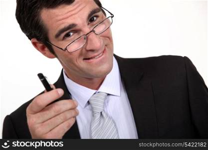 Businessman pointing his pen at you
