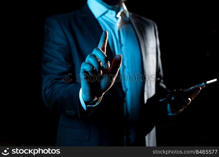 Businessman Pointing Important Infortmations With One Finger.. With One Finger Pointing Important Infortmations With Other Hand Holding Tablet. Businessman Showing Recent Updates. Executive Displaying Critical Messages.