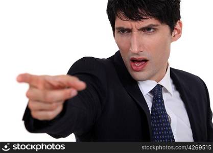 Businessman pointing in anger