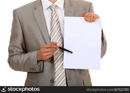Businessman pointing to a blank sheet of paper