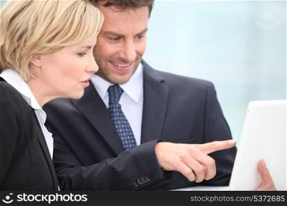 Businessman pointing to laptop