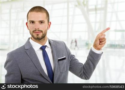 businessman pointing with his finger, at the office