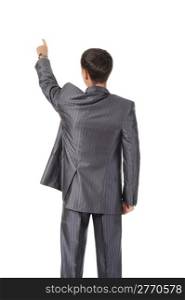 Businessman points finger up. Isolated on white