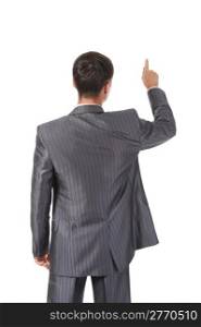 Businessman points finger up. Isolated on white background