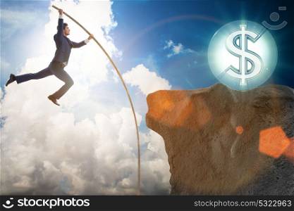 Businessman pole vaulting towards his money goal