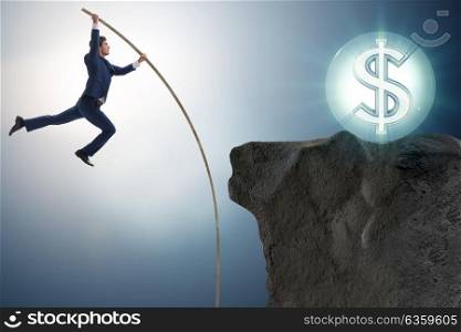 Businessman pole vaulting towards his money goal