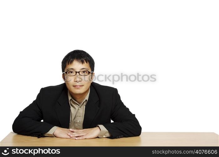 Businessman posing in an office, with copy space