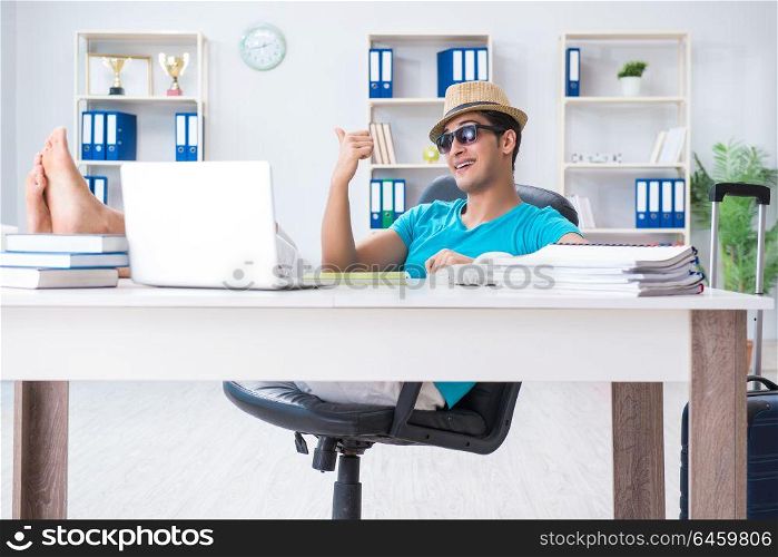 Businessman preparing for vacation in the office