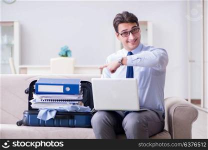 Businessman preparing packing for business trip