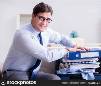 Businessman preparing packing for business trip. The businessman preparing packing for business trip