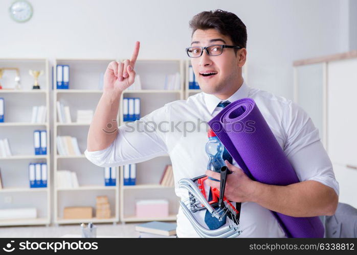 Businessman preparing to go exercising in gym