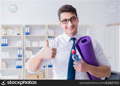 Businessman preparing to go exercising in gym