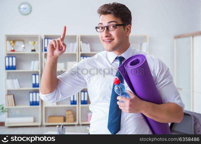 Businessman preparing to go exercising in gym. The businessman preparing to go exercising in gym