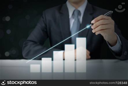 businessman present rising graph, business growth concept