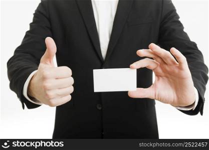 businessman presenting business card doing thumbs up gesture