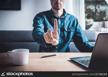 Businessman pressing button on virtual screen. Man pointing on futuristic interface. Innovation technology internet and business concept. Space for text and words. Abstract background