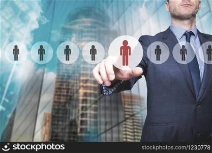 Businessman pressing button on virtual screens. Business, technology, internet, networking and recruitment concept - Isolated on skyscraper background. Stock Photo