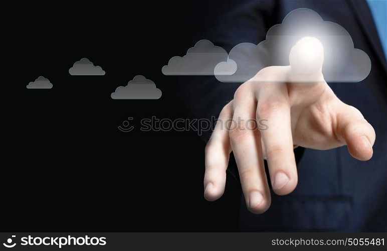 Businessman pressing cloud icon on media screen . Cloud computing
