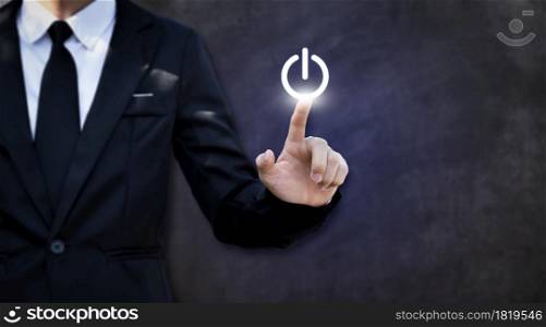 Businessman pressing power button. Concept of technology, internet and business.