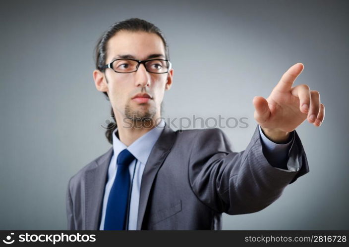 Businessman pressing virtual buttons