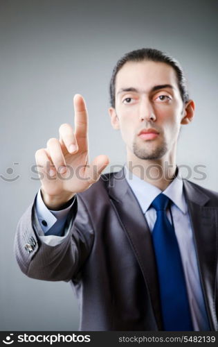 Businessman pressing virtual buttons