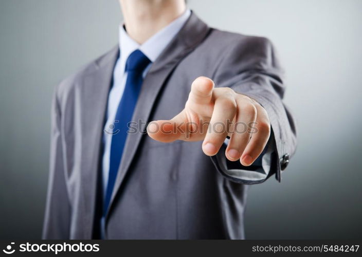 Businessman pressing virtual buttons