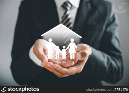 Businessman protective gesture resonates with young family silhouette. Health and house insurance icons accentuate safety, reinforcing family support concepts. Family life insurance. Family life insurance