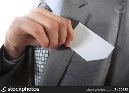 Businessman pulling a business card out of his pocket