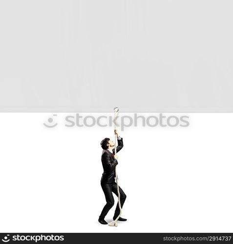 Businessman pulling banner