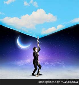 Businessman pulling banner. Image of businessman pulling banner with illustration. Day and night concept