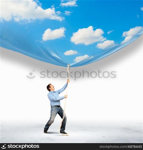 Businessman pulling banner. Image of businessman pulling banner with illustration. Day and night concept