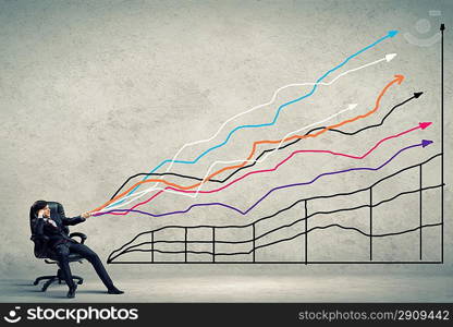 Businessman pulling graph