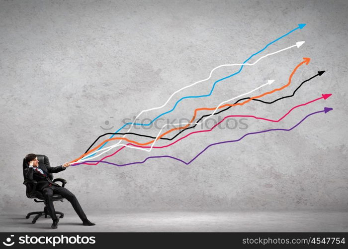 Businessman pulling graph. Image of young businessman pulling graph. Chart growth concept