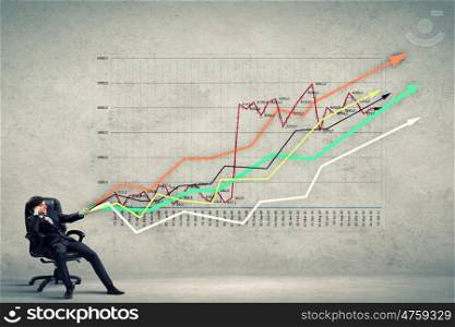 Businessman pulling graph. Image of young businessman pulling graph. Chart growth concept