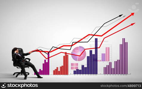 Businessman pulling graph. Image of young businessman pulling graph. Chart growth concept