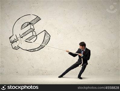 Businessman pulling rope. Image of young businessman pulling euro sign rope with