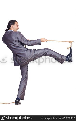 Businessman pulling rope on white