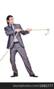 Businessman pulling rope on white