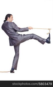 Businessman pulling rope on white