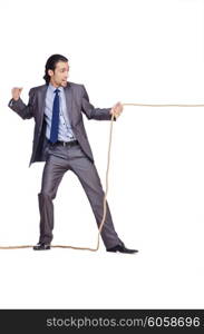 Businessman pulling rope on white