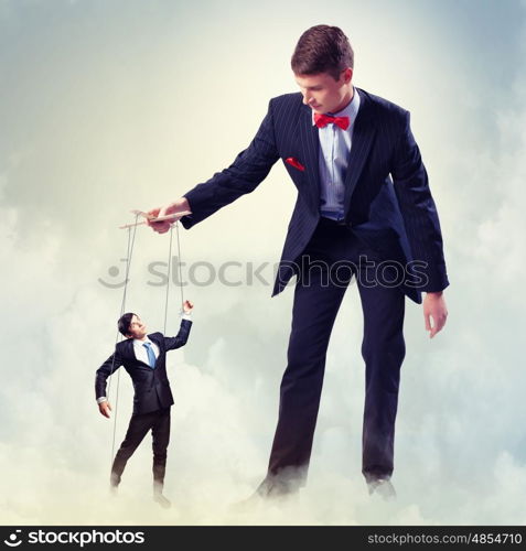 Businessman puppeteer. Image of young businessman puppeteer. Leadership concept