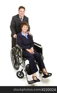 Businessman pushing a disabled businesswoman in her wheelchair. Full body isolated.