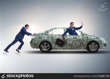 Businessman pushing car in business concept