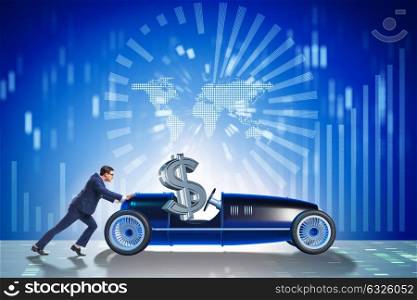Businessman pushing car with dollar in driving seat