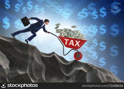 Businessman pushing wheelbarrow with tax money
