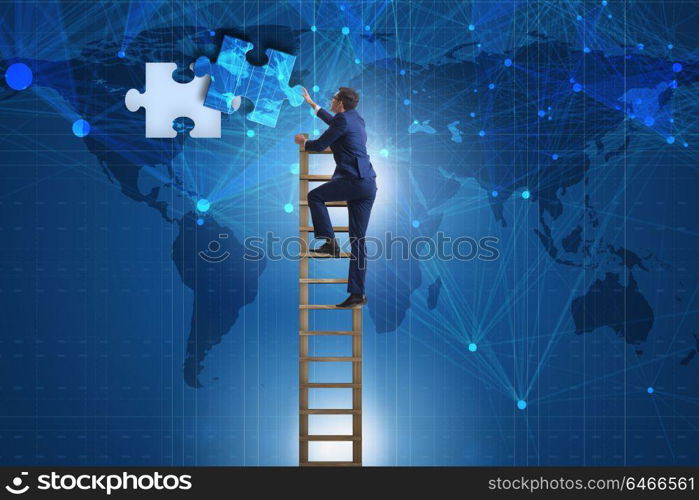 Businessman putting together jigsaw puzzle pieces